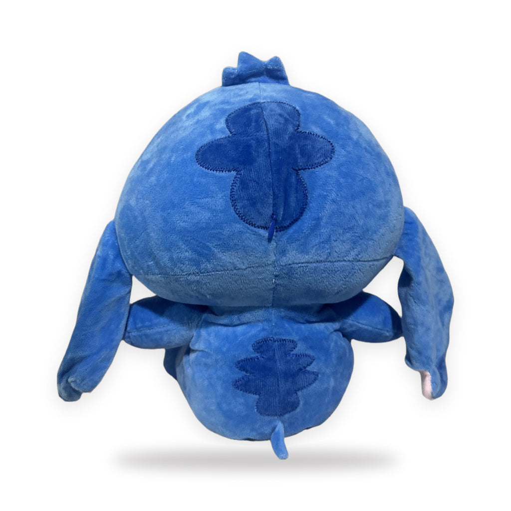 Peluche azul que respira, vista de espalda